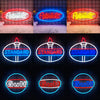 A collection of neon signs featuring the Peterbilt truck logo and the Gulf oil company name.
