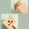 A beige cat-shaped adhesive hook is shown in two views, demonstrating its design and size.