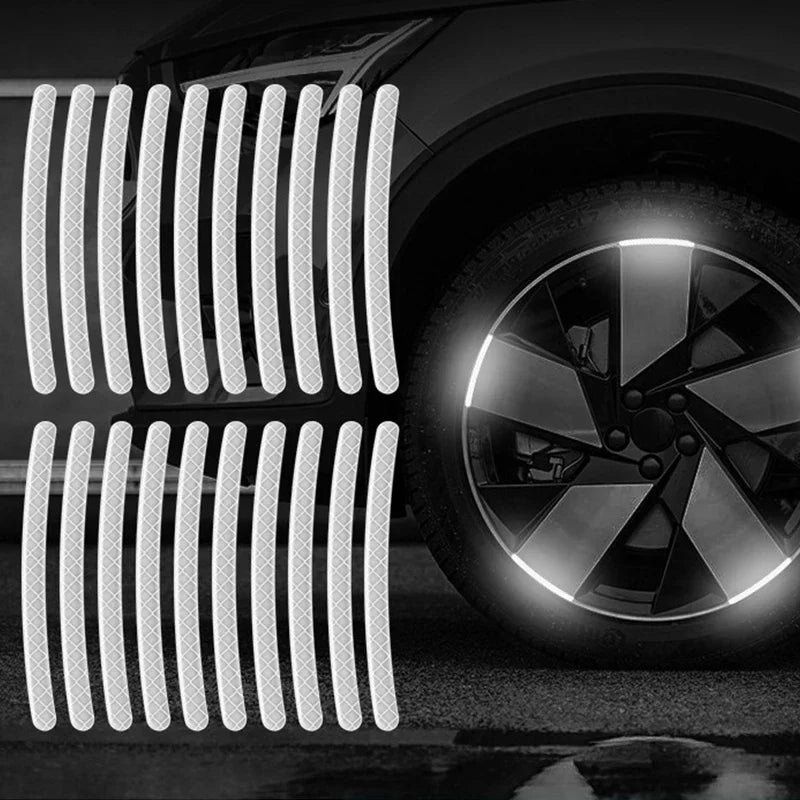 Close-up of a car wheel with reflective strips installed on the rim.