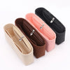 Three felt bag organizers in beige, pink, and black with zippers shown diagonally.