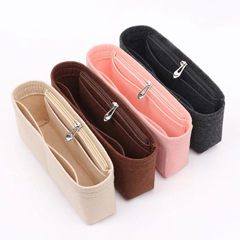 Three felt bag organizers in beige, pink, and black with zippers shown diagonally.