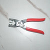 A pair of silver metal snap buttons with red handles for clothing, bags, and DIY crafts.