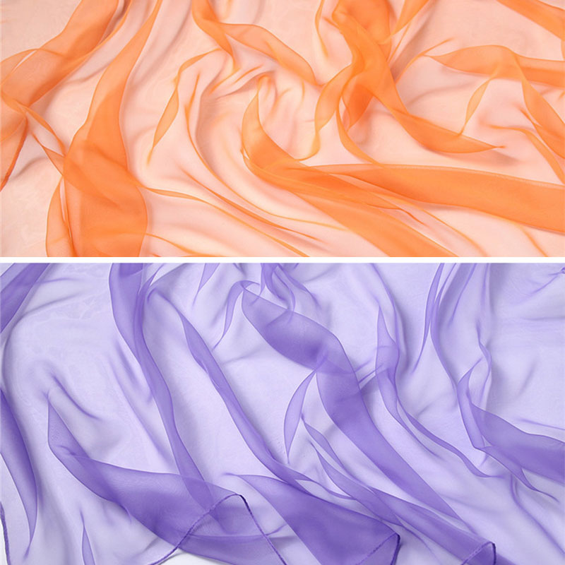 Flowing fabric in shades of orange and purple used for imaginative play