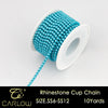 A spool of turquoise glass rhinestones used to create a cup chain for DIY clothing decoration.