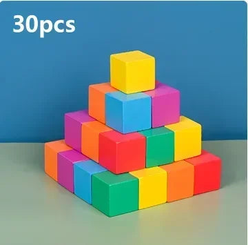 A stack of 30 colorful soft silicone building blocks in various shades of yellow, blue, and pink.