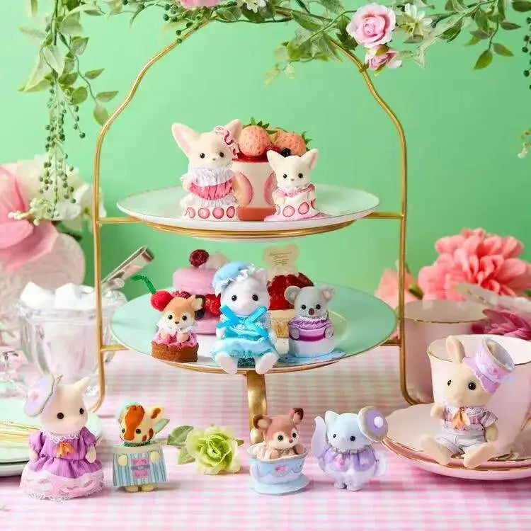 A collection of Sylvanian Families tea party baby figures in various outfits and accessories displayed on a gold stand.