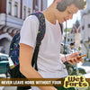 A young man is using a smartphone while wearing a backpack and headphones in an outdoor setting.