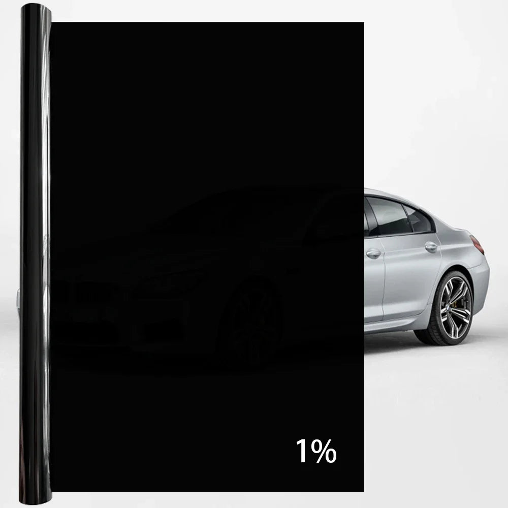 A close-up view of a black ceramic privacy film applied to a car window.