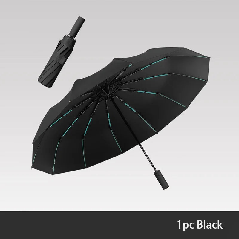 A black windproof travel umbrella is shown open against a light gray background.