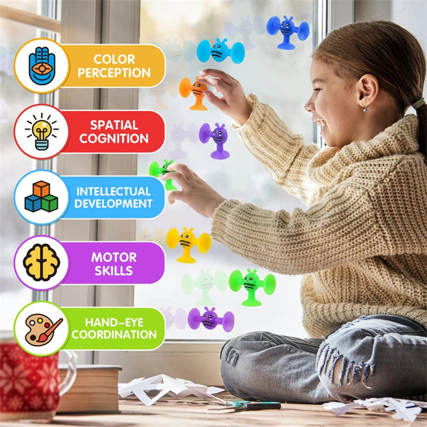 A young girl is interacting with colorful silicone animal building blocks, demonstrating various cognitive and motor skills.