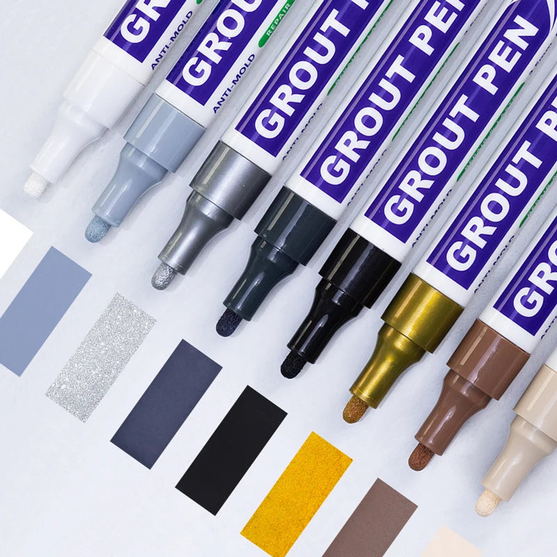 A collection of grout pens in various colors and shades, showing the tips and packaging.