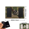 Tactical patch featuring an eagle skull design on a camouflage background with hook and loop backing