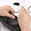 Hands are using a sewing needle and heavy duty nylon thread to repair black leather upholstery.