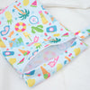 A light blue patterned mini waterproof wet dry bag for baby, featuring fruit and colorful designs.