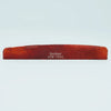A wooden acoustic guitar bridge saddle with the name Guyker ATR-7631 engraved on it.