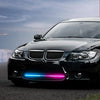 A black car with an RGB LED light strip visible on the front bumper.