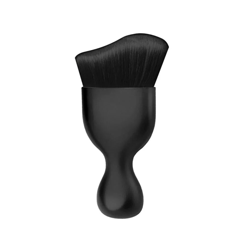 A black ultra-soft curved detailing brush with a tapered handle and dense bristles.