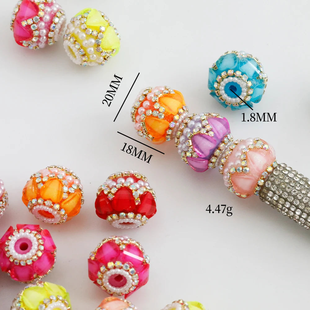 A collection of colorful rhinestone round beads and a finished beaded bracelet for jewelry making.