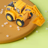 A yellow diecast push-play excavator and bulldozer set resting on a green surface with scattered white balls.