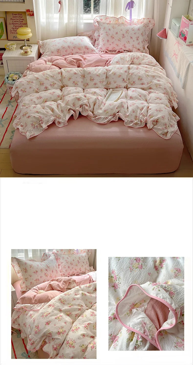 A pink floral duvet cover set with matching pillowcases and a flat sheet displayed on a bed.