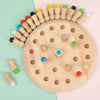 A wooden memory chess game for kids with various colored wooden pieces arranged in a circular pattern.
