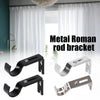 A set of metal Roman rod brackets for curtain rods shown against a white window backdrop.