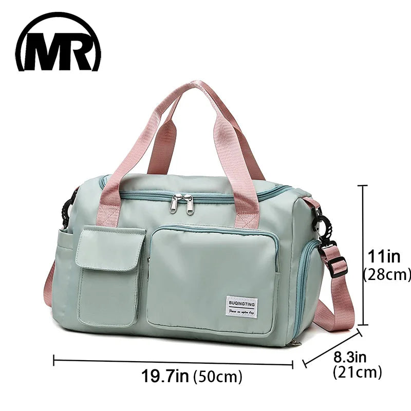 A light mint green waterproof travel duffle bag with a separate shoe compartment and pink straps.