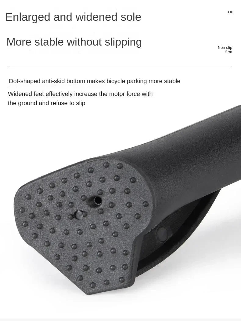 Close-up view of a black bicycle kickstand with a dot-shaped anti-skid bottom.