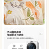 A set of light-colored bedding, including a duvet cover, fitted sheet, and pillows, is displayed on a bed.