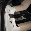 A close-up view of a magnetic car phone mount with a cup holder base installed in a vehicle interior.