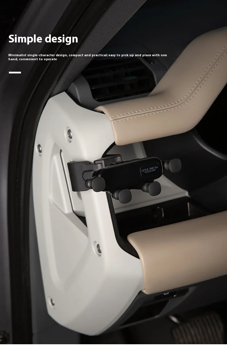 A close-up view of a magnetic car phone mount with a cup holder base installed in a vehicle interior.