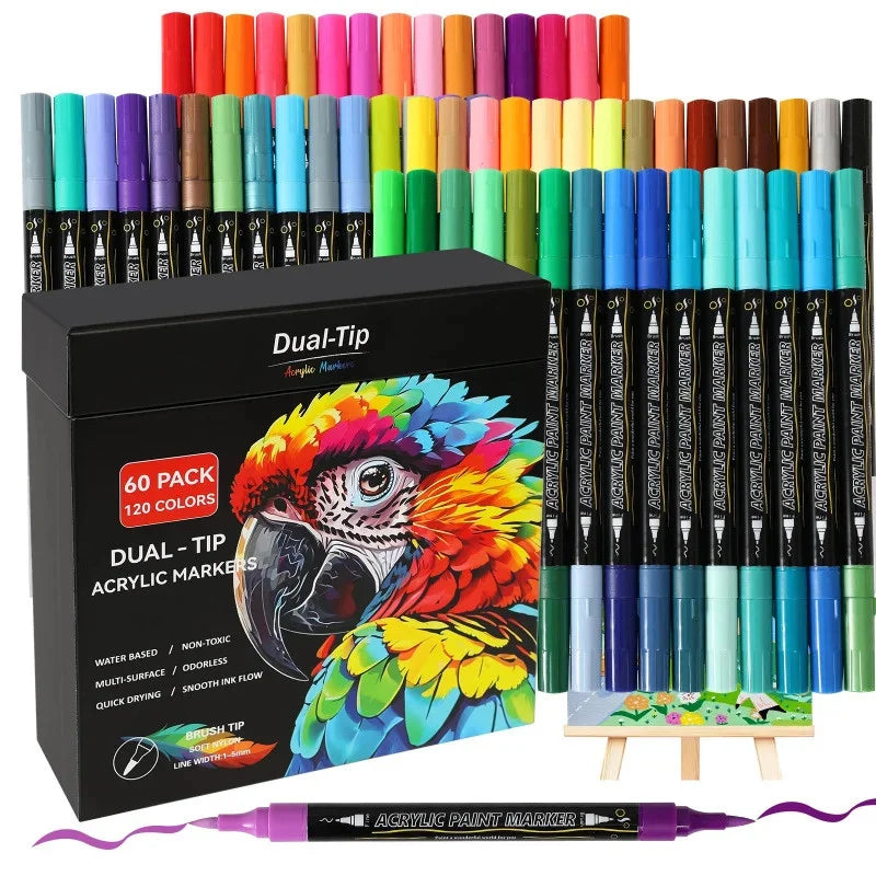 A set of dual-tip acrylic paint markers in various colors packaged in a box, displayed next to an artist's palette.