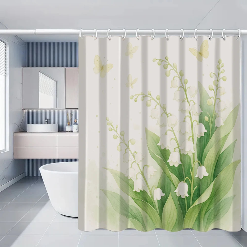 A beige floral shower curtain featuring green leaves and white flowers hanging in a bathroom.