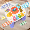 A white interactive baby learning table featuring animal sound buttons and rotating piano keys.