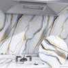 Marble effect peel-and-stick wallpaper featuring white marble with gold veining on a kitchen backsplash.