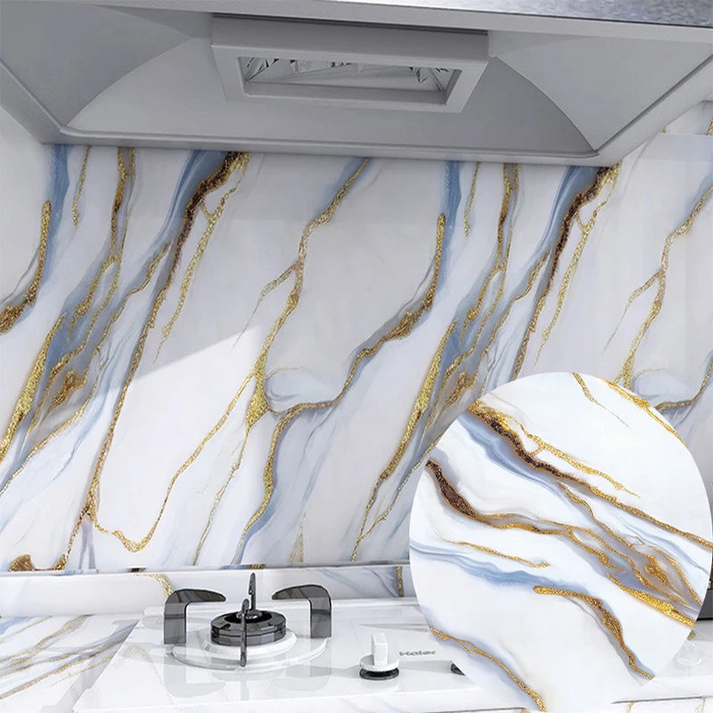 Marble effect peel-and-stick wallpaper featuring white marble with gold veining on a kitchen backsplash.