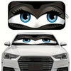 Close-up of a cartoon folding car sunshade featuring large blue eyes.