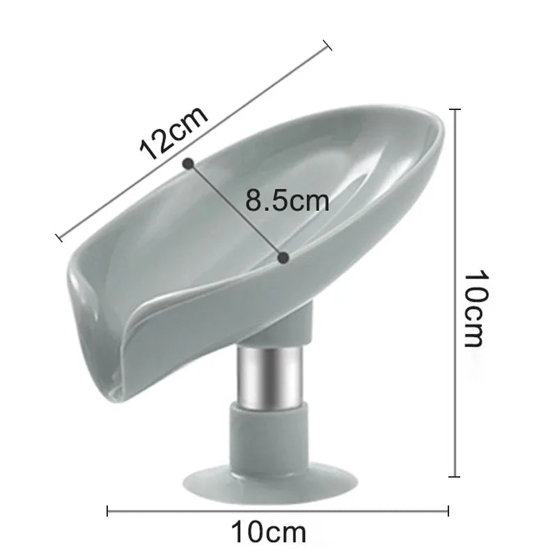 A gray leaf-shaped suction cup soap dish with a self-draining tray and a cylindrical base.