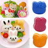 A set of pink and orange rice ball moulds for making cute bento items like cats, bears, and rabbits.