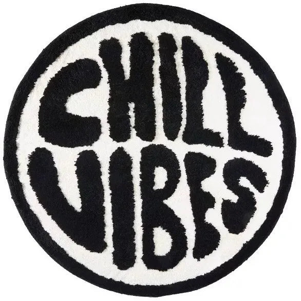 A round black and white letter design featuring the words CHILL VIBES on a fluffy carpet.