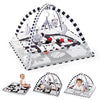 A baby play gym and activity mat with hanging toys featuring a black and white pattern.