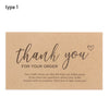 A thank you note card with handwritten text saying thank you for your order on kraft paper.