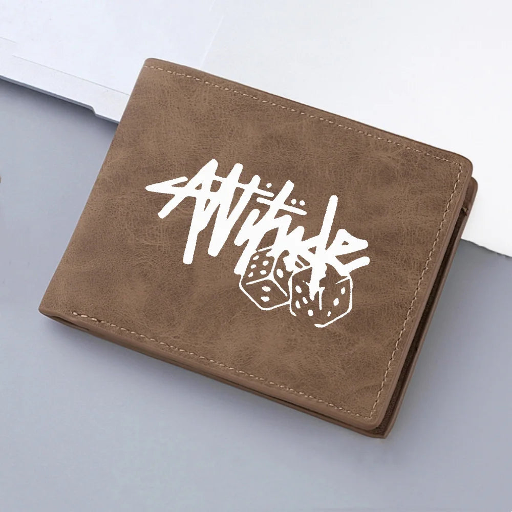 A brown PU leather wallet with white stylized text and dice design lying on a light gray surface.
