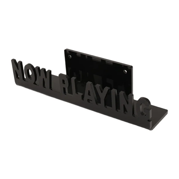 Black wall-mounted vinyl record display shelf with the words NOW PLAYING cut into the material