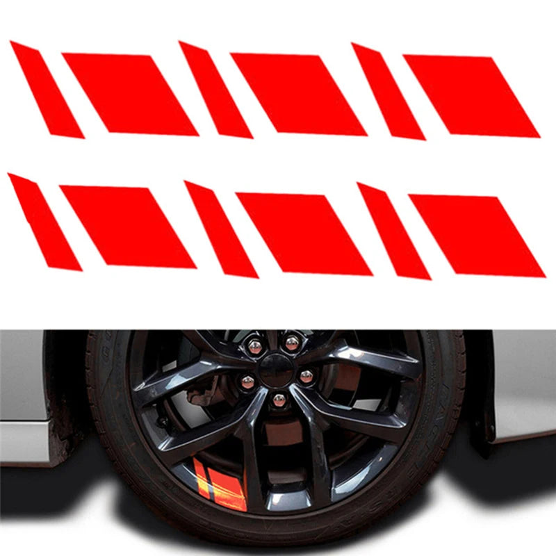A set of six red reflective wheel hub stickers arranged in a row.