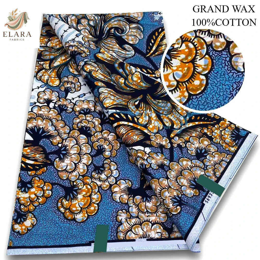 A bolt of grand wax 100% cotton fabric featuring an orange and blue floral pattern.