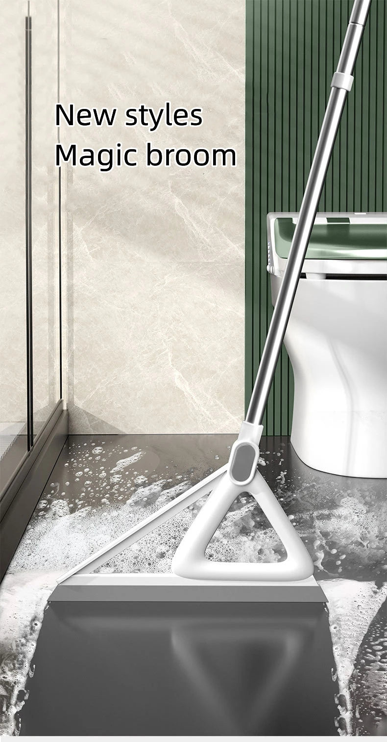 A silver squeegee broom is shown cleaning a floor near a toilet bowl.