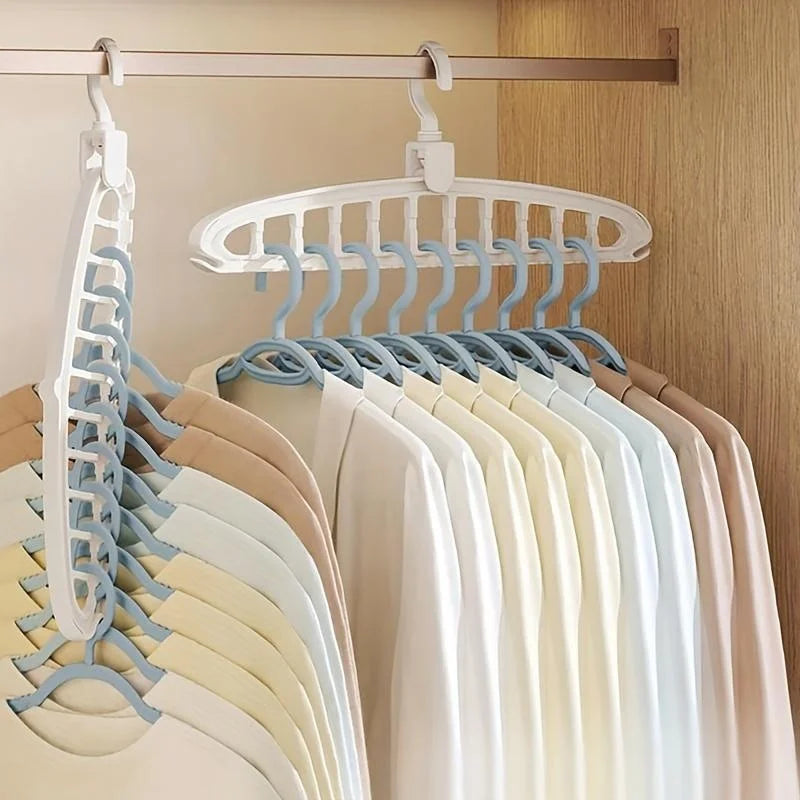 A white clothes hanger with multiple blue hooks is displayed on a wooden rack.