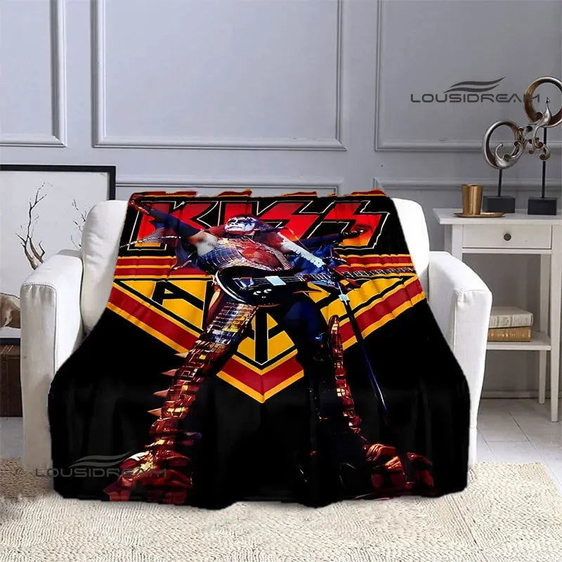 A black flannel throw blanket featuring a graphic print of the KISS band members.