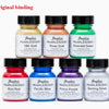 A collection of Angelus Pearlescent leather paint bottles in various colors including Gold, Rose, Emerald Green, and Blue.